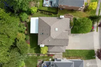 Drone drop! Showcasing that gorgeous 50-year architectural roof—because protection and curb appeal go hand in hand.