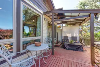 Enjoy the views from this covered seating area on deck for outside living every day!