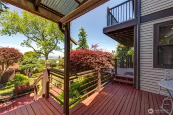 Large deck leads out to the beautiful gardens and green house!