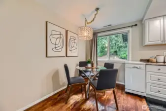 The dining room is just off the kitchen boasting a beautiful chandelier