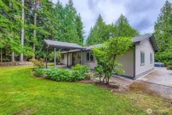 Mature landscaping frames the home.