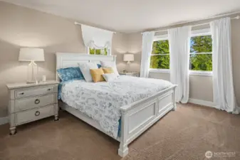 Spacious primary bedroom overlooking the views.