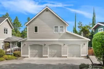 Three car garage with workshop & large ~700 sf adu studio.