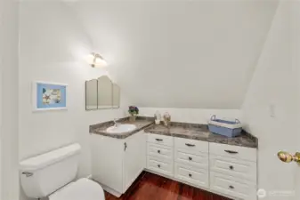 The 2nd floor upstairs bath brings seashells, with custom seashell tile work in the shower, a favorite of the owners.