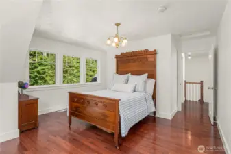 An additional upstairs bedroom, could be a den, offers plenty of charm with the same dark wood floors, dormer windows and dark wood flooring found throughout the home. There is a alcove for a dressing space, if needed.