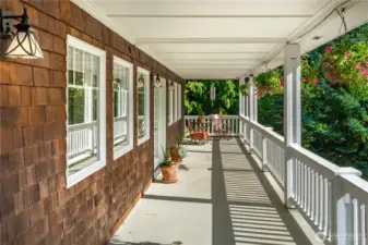 The terrace off the entry way and living room is perfect for intimate alfresco dining while enjoying the garden and the views!