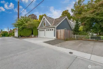 Large garage with dwelling above. Accessed off the alley.