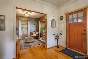 Entry. Living room in the background could be a large office/den