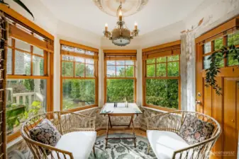 Sitting room directly off the kitchen can be used for dining area as well. Door leads out to the wrap around covered deck leading all the way to the front door.
