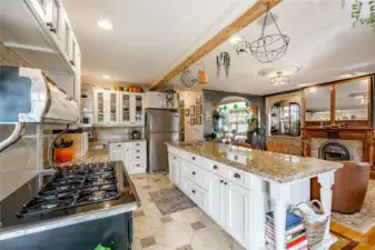 Large open kitchen. background archway leads to the front of the home.