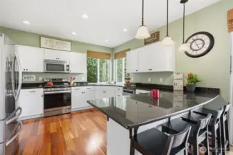So much cabinet and counter space with large eating bar.