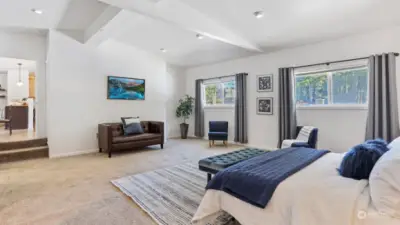 Enjoy vaulted ceilings and walls of windows in the primary.