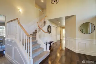 One of two graceful staircases to the upper level.