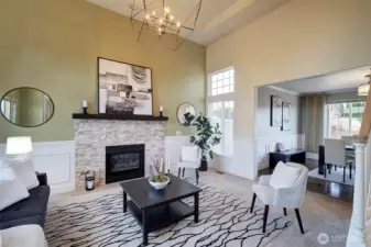 A stone fireplace and wainscotting add ambiance to this area of the home.