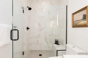 Primary suite shower.  Photos are staged model of same floorplan.  Color schemes may vary.