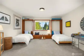 Third bedroom includes twin built-in murphy beds.