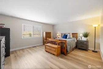 Large primary bedroom with attached 5 piece bathroom & walk-in closet