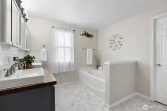 Attached primary bedroom 5 piece bathroom with large walk-in closet