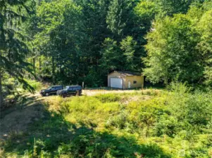 THE 672 SF GARAGE OUTBUILDING WAS BUILT W/ PERMITS IN 1997 & IS THE PERFECT SPACE TO STAGE A NEW BUILD PROJECT.  THE GARAGE DOOR IS 16X10 & HAS POWER.