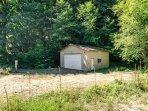 GARAGE AND UTILITY POLE IN LEFT OF FRAME.