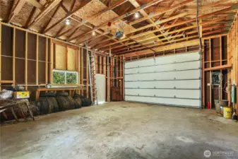 POWERED GARAGE DOOR & STORAGE SPACE FOR SUPPLIES.