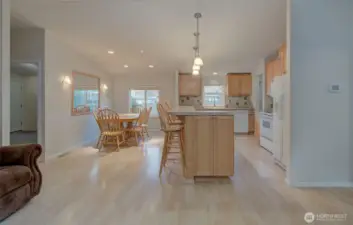 Dining room and kitchen with eating bar.