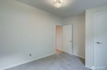 Bedroom #2 with new carpet and closet.