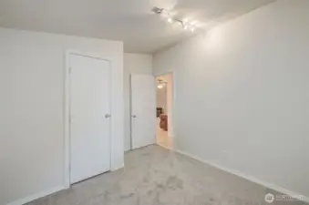 Bedroom #3 with new carpet and closet.