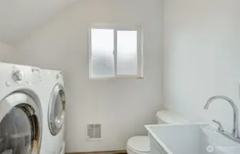1/2 bath with laundry in shop.