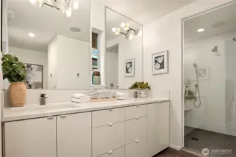 A spa-inspired primary bath with dual vanity, clean modern finishes and a spacious steam shower.