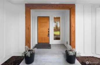 Beautiful covered front entryway with solid wood beam work and solid wood door. Tons of natural light with great sized window leading directly into this beautiful 5 bedroom, 3,000+ sqft home.