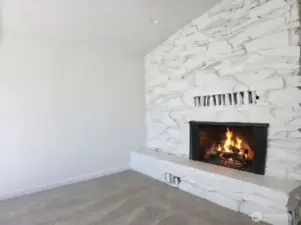 Statement wood burning fireplace will keep you warm and cozy. Solid stone surround with fireplace ledge.