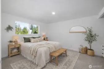 Very large 4th bedroom with large closet and views of property and fenced yard. Built in work desk, new carpeting, fresh paint, and recessed lighting. Photo is virtually staged.