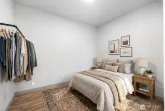 Fantastic sized additional room in ADU of entryway! This space fits a queen sized bed wonderfully with additional room for night stands. Photo is virtually staged.