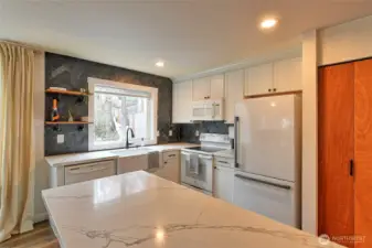 Another look into the kitchen nice quartz counter tops