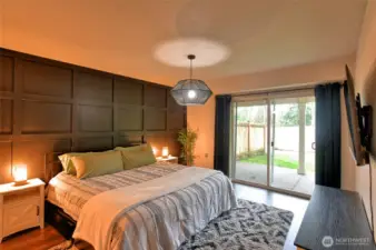 Check out the woodwork in the primary, looking out to covered porch.