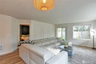 Living room looking into primary bedroom.