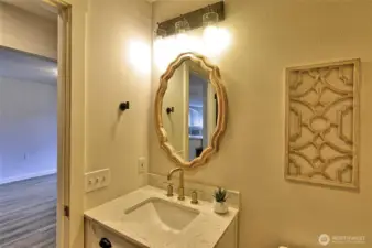 Full bathroom sink, one of the bedrooms to the left.