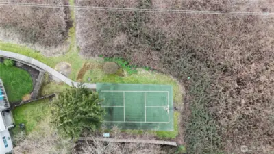 Looking down on the basketball court, or pickle ball court. Unit F104 is not far from the shared court.