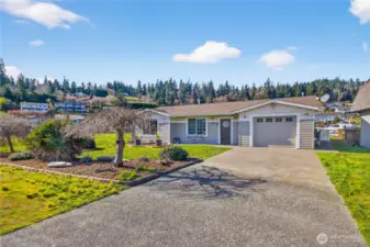 Enjoy the best of both worlds with this canal-front home featuring serene water views from the backyard and stunning mountain views from the front, all set in a peaceful, well-kept setting.