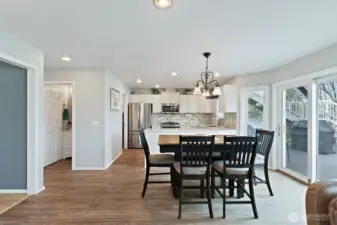 Looking in to the kitchen. Sliding door to the back deck and fenced yard.