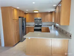 21116 Stainless appliances, Tile floor, Shaker cabinets