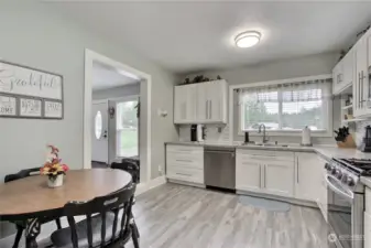 Guest house kitchen, room to eat in, in addition to your dining room. Matching stainless steel appliances included and nice cabinetry!