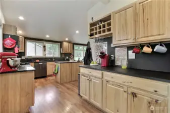 View of the main house kitchen from the back patio doors, look at all the storage and counter space.