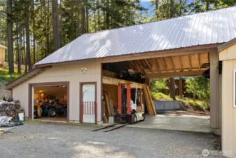 Covered Carport with storage above and garage access.