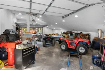 Garage with snowmobile lift and winch.
