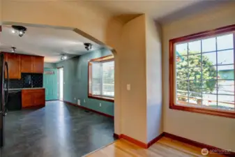 Looking into the kitchen from dining room.   The kitchen has room to put another table for eating if needed.