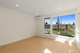 Photos of model home with similar finishes & floor plan. Sun-drenched corner room with warm wood flooring and expansive windows for natural light all day.