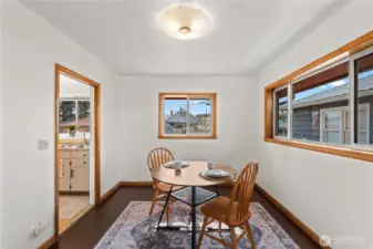 This charming dining area is perfect for intimate dinners, offering a cozy space that flows effortlessly into the main living area.