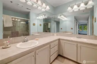 Dual sink vanity in private primary bath.